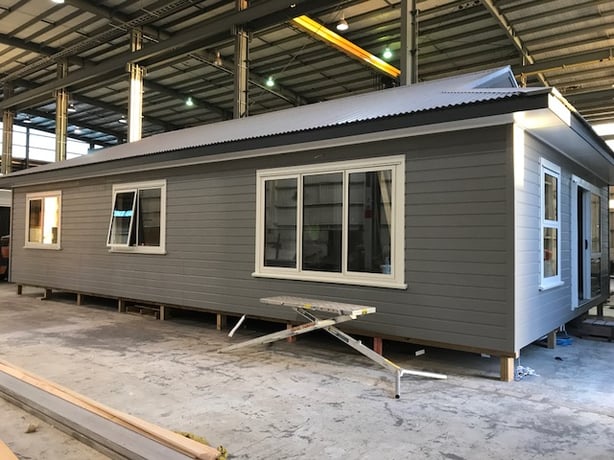 A prefabricated home being built in a factory ensure less time wasted on bad weather