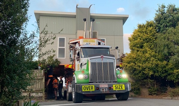 Prefab home being delivered to site